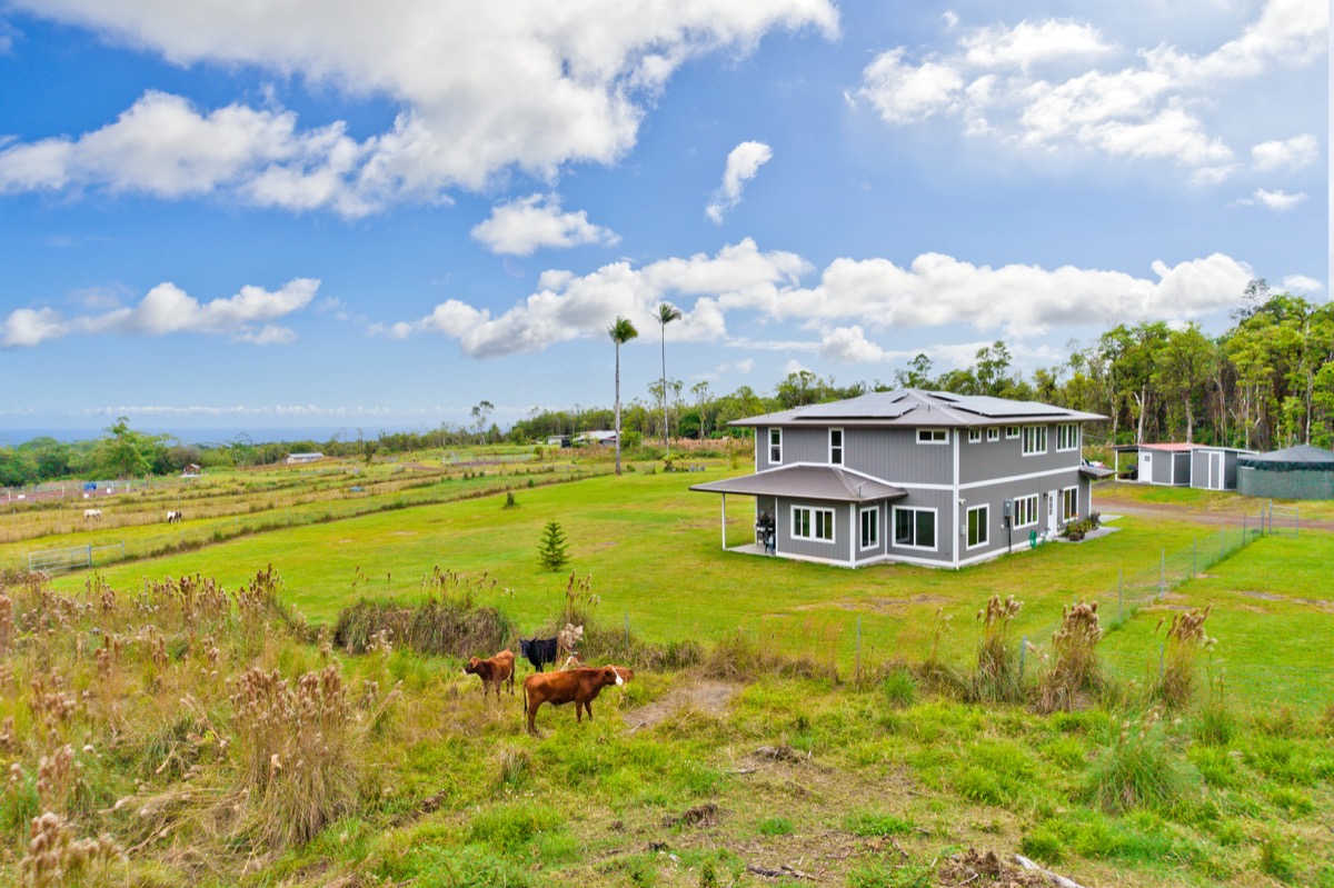 Two-story 2023 ranch-style estate with ocean views on acreage in Mountain View, Puna